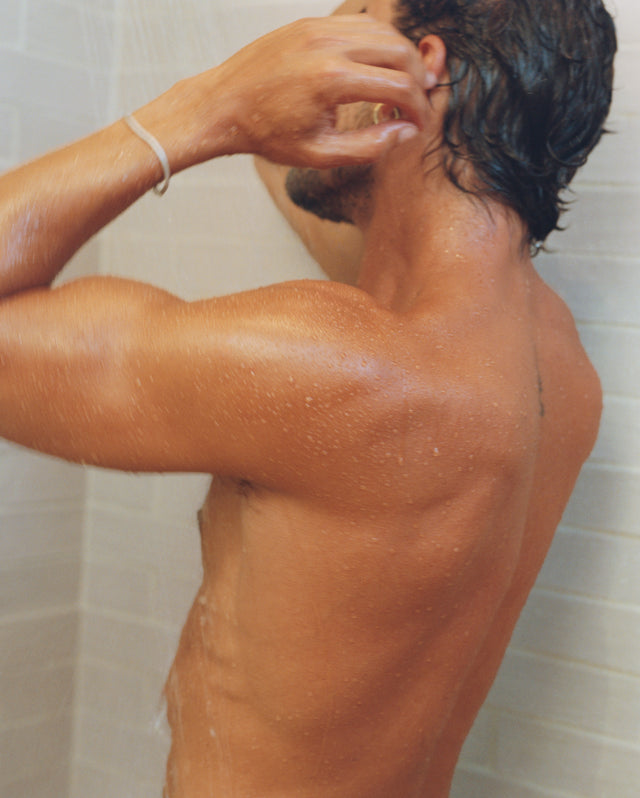 Person washing their hair in the shower